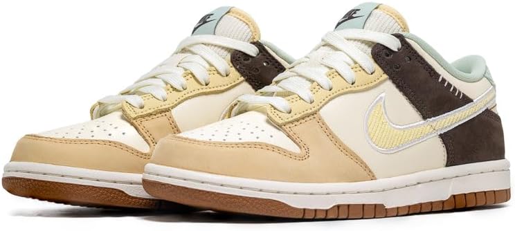 Kids' Nike Dunk Low sneakers, cream/yellow with dark brown toe and light blue swoosh