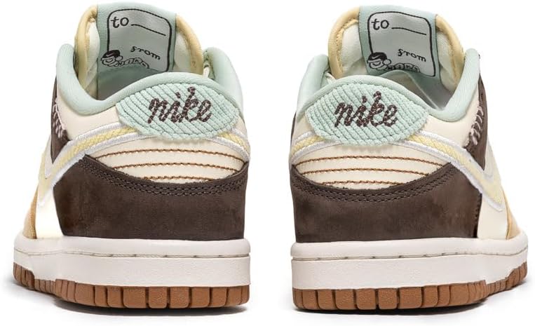 Kids' Nike Dunk Low sneakers, heel view with mint lining, 'nike' script, and brown sole