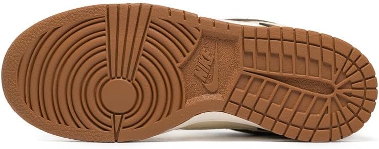 Kids' Nike Dunk Low outsole, brown rubber tread with circular traction pattern