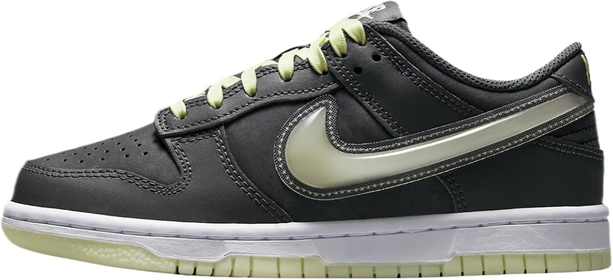 Kids' low-top sneakers in dark gray with light gray swoosh and lime green laces