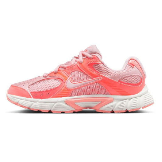 Kids pink running shoes with mesh uppers, lace-up front, and white cushioned sole