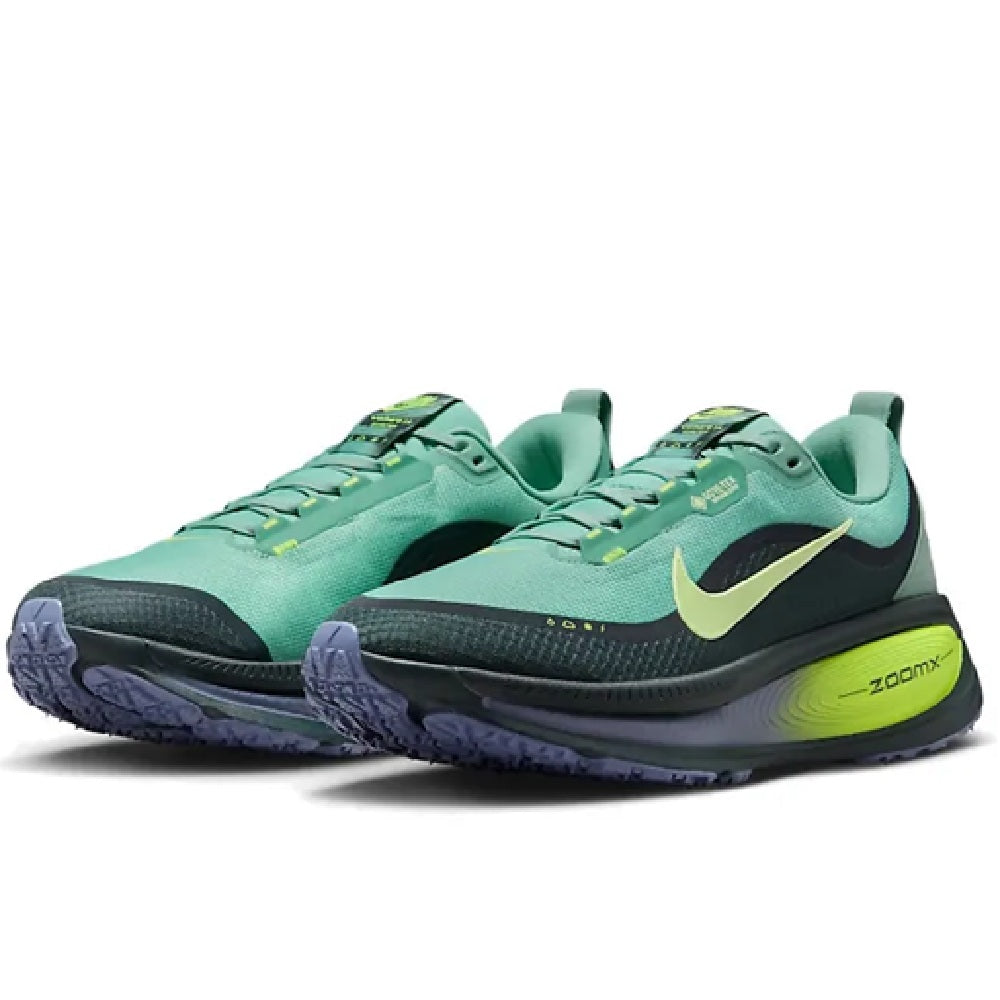 Pair of men's Nike GTX sneakers, seafoam green with black swoosh and neon laces