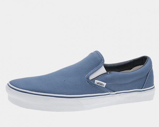 Blue canvas slip-on sneaker with white sole and side Vans logo patch