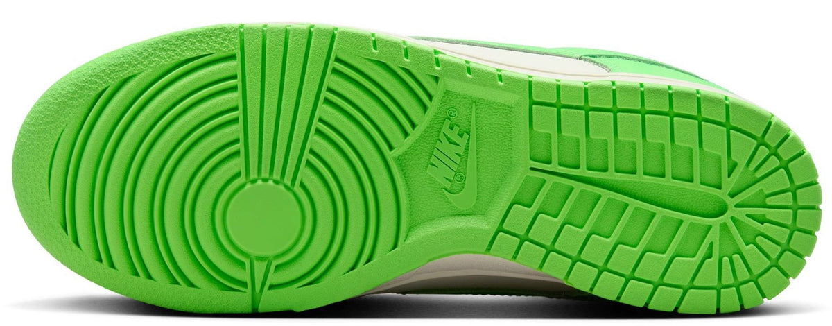Nike Dunk Low outsole view with bright green rubber tread and herringbone traction pattern.