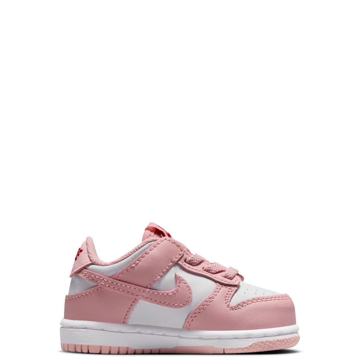 Toddler Nike Dunk Low sneakers, side view with pink leather panels and white midsole.