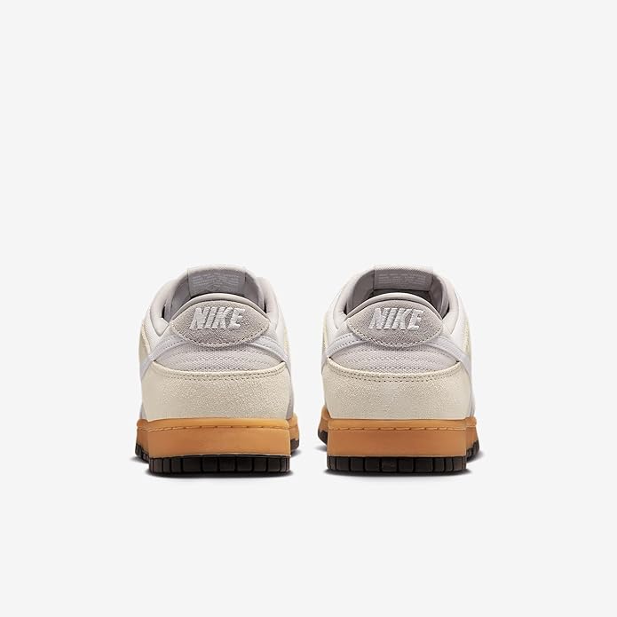 Nike Dunk Low sneakers, back view, off-white heel with Nike logo and gum sole