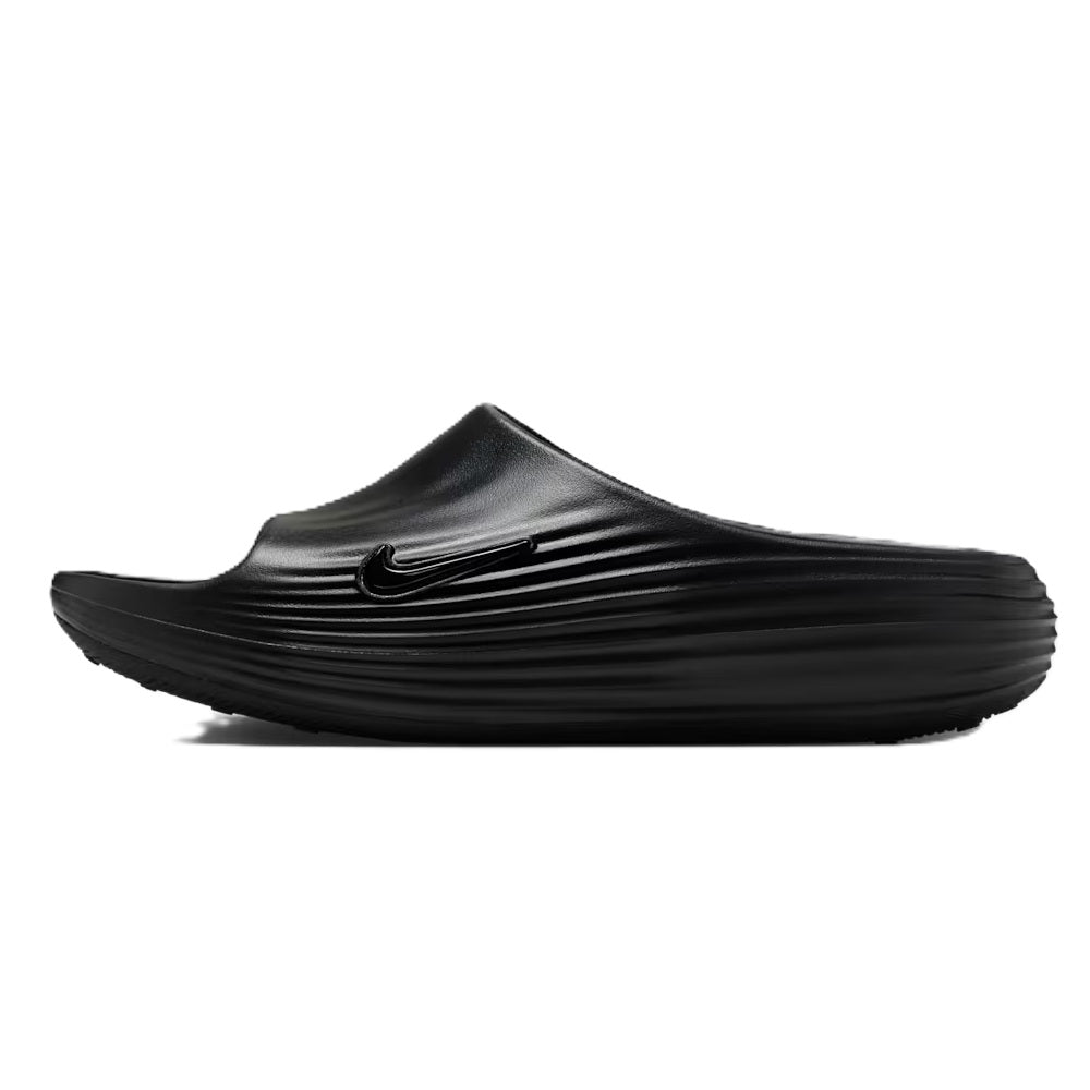 Black slide sandals with Nike swoosh on the top strap