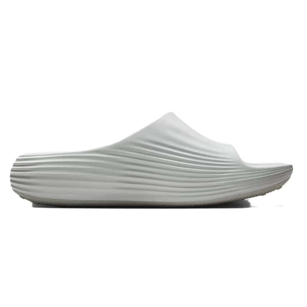 White slide sandal with ribbed strap upper and low-profile outsole