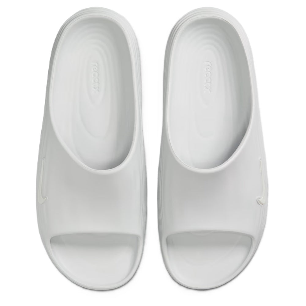 Pair of white slide footbeds with Nike swoosh embossing