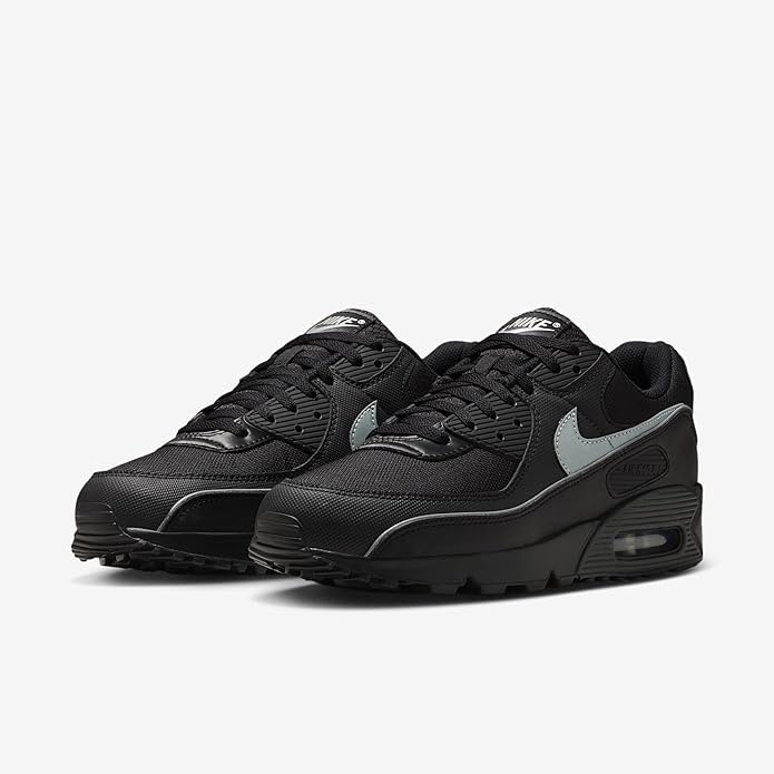 Black lace-up sneakers with gray Swoosh and layered overlays; Air Max heel window