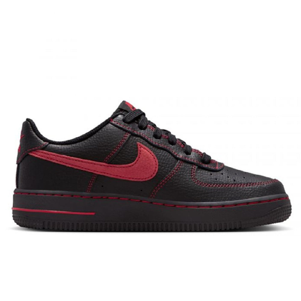 Black low-top sneakers with red swoosh, lace-up front, and side stripe accents