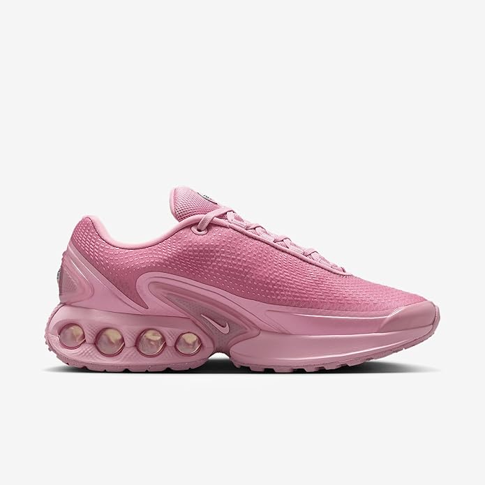 Pink Nike Air Max DN running shoes with textured mesh upper and sculpted midsole