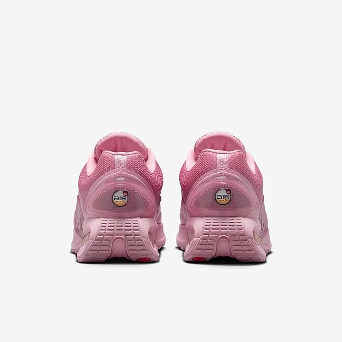 Pink Nike Air Max DN sneakers with 'Air' heel window and cushioned back