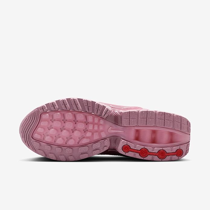 Pink Nike Air Max DN rubber outsole with tread pattern and red traction accents