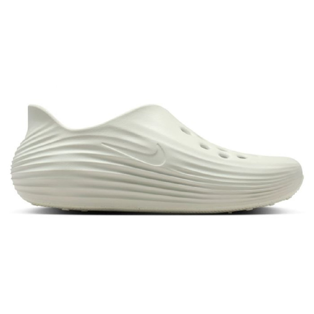 Men's Nike ReactX slip-on sneakers, white side profile with teal Swoosh