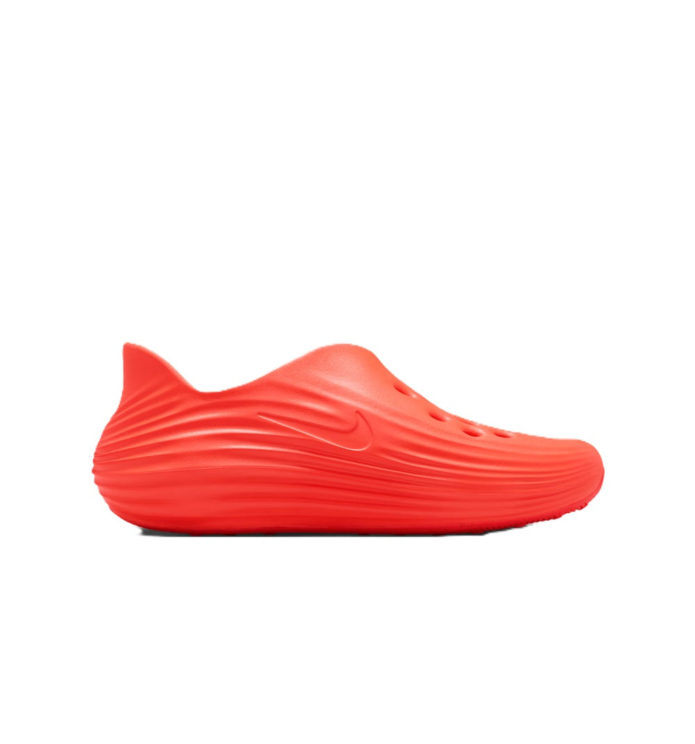 Men's Nike slide sandal, side view in bright red with swoosh on textured upper