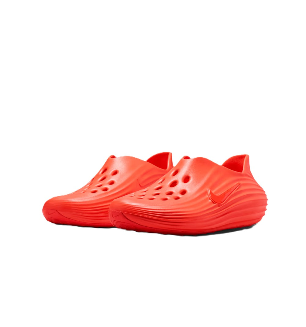 Men's Nike slide sandal pair in bright red with perforations and curved midsole