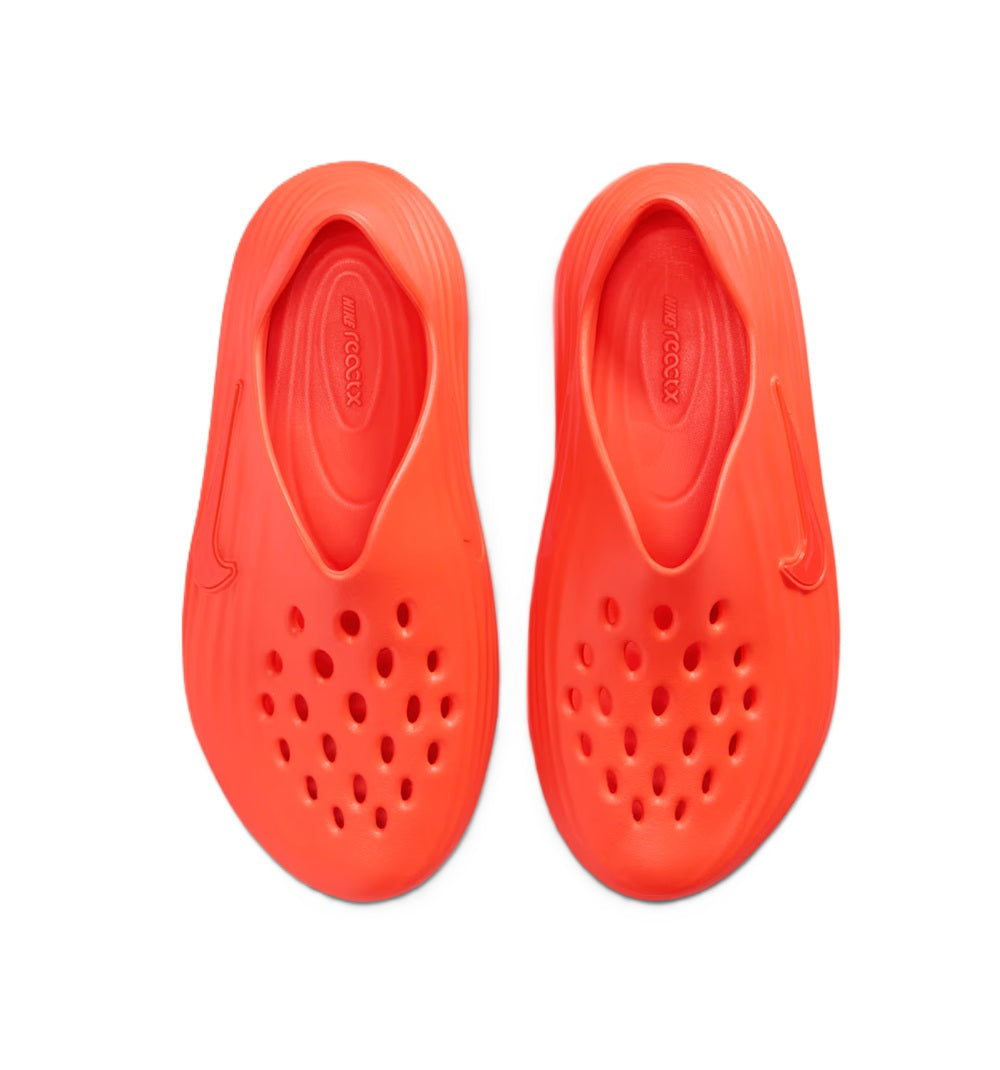 Pair of bright red Nike slide footbeds with perforations and embossed heel logo