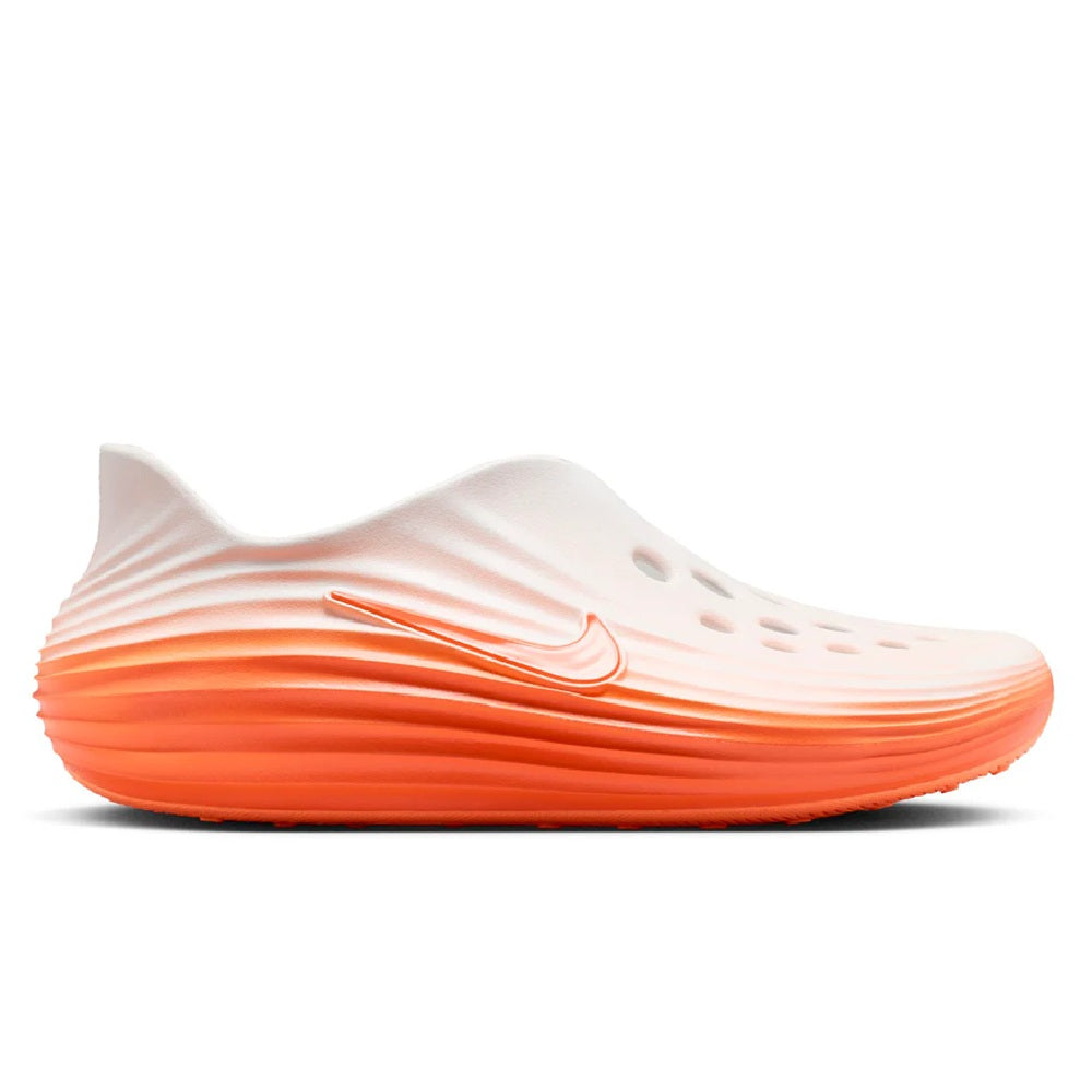 Men's Nike running shoe in white and orange with Swoosh logo and sculpted sole
