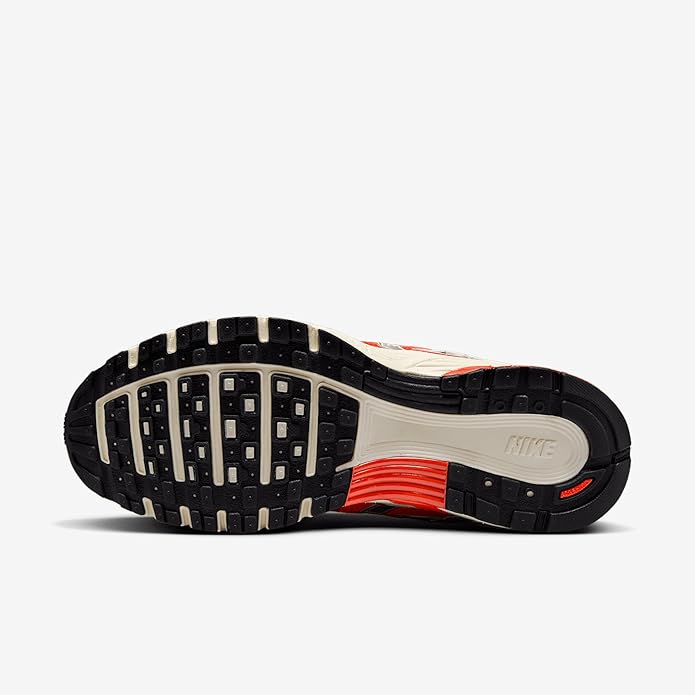 Women's Nike P-6000 sneaker outsole view, black traction with red midsole stripe