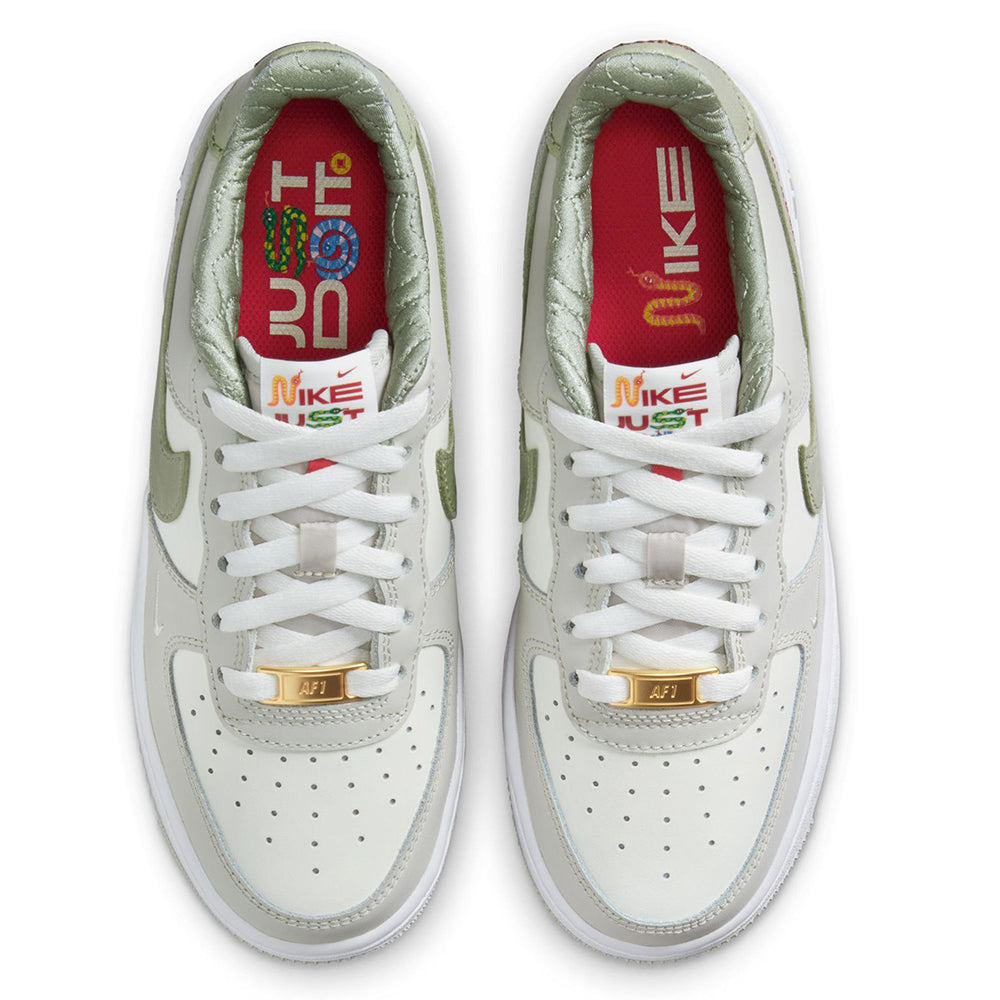 Big kid's Nike Air Force 1 LV8 sneakers with white laces and green lining