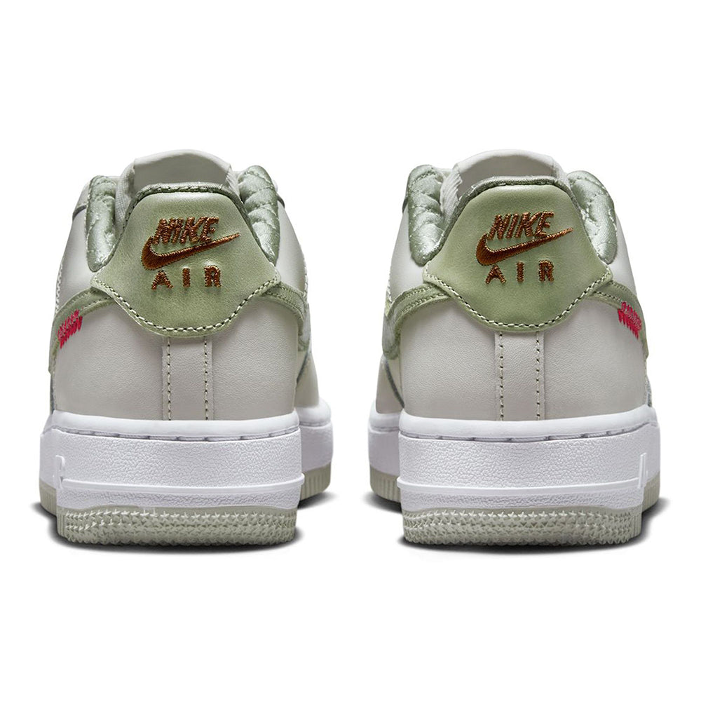 Big kid's Nike Air Force 1 LV8 heel view with olive collar and white midsole