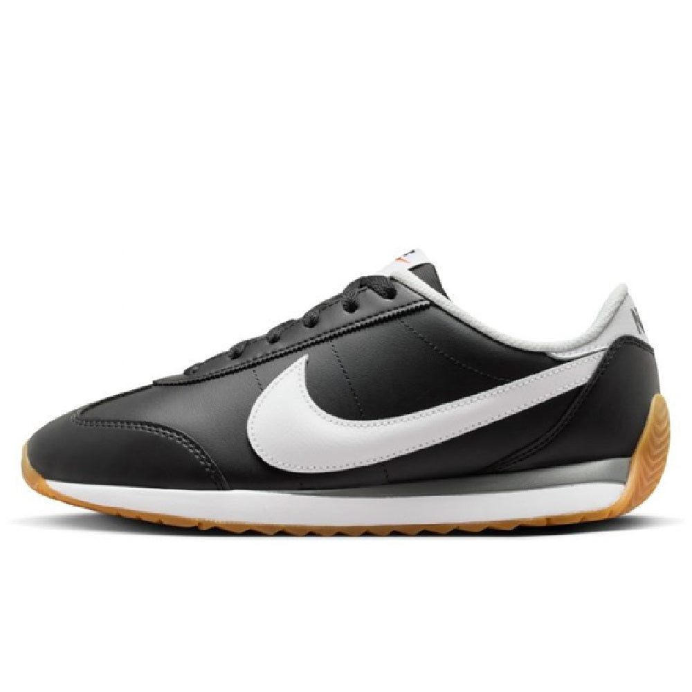 Nike women's low-top sneakers, black leather-look with white swoosh and gum sole