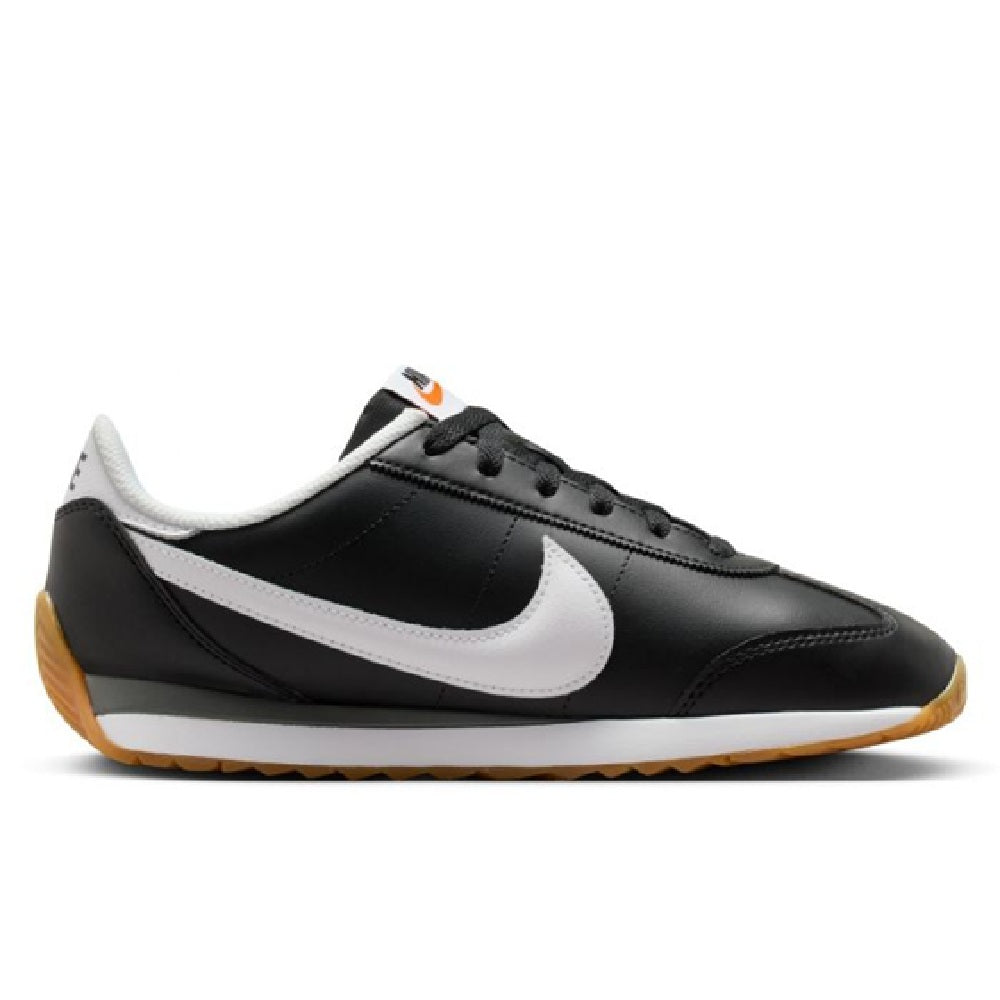 Nike low-top sneakers in black with white swoosh and gum rubber outsole