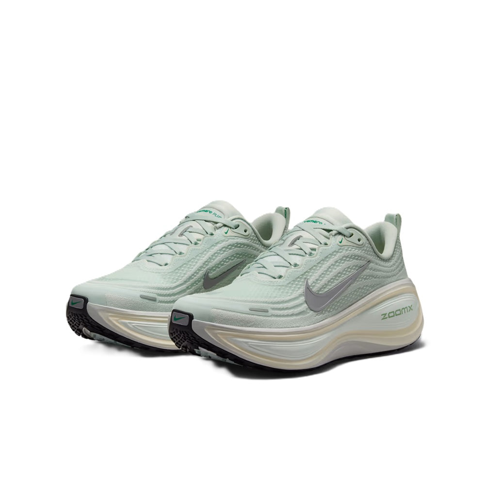 Nike Vomero Plus light silver angled pair showing lace-up uppers and ZoomX midsole