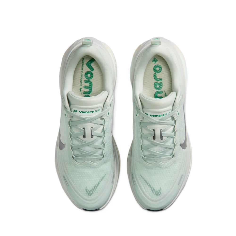 Nike Vomero Plus light silver interior view with green logo on insole