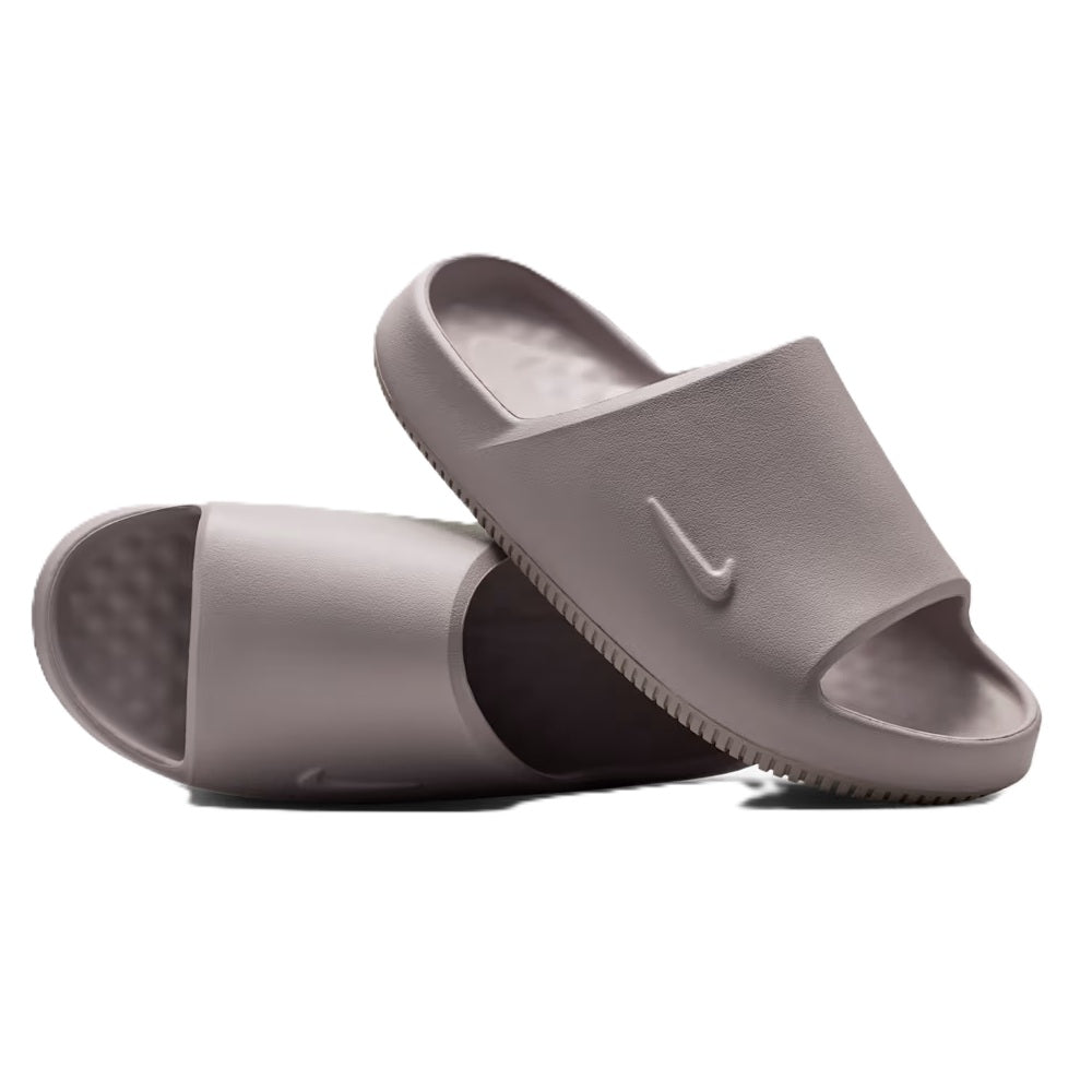 Men's Nike Calm Slide 2.0 sandals shown side view with open toe and textured outsole.