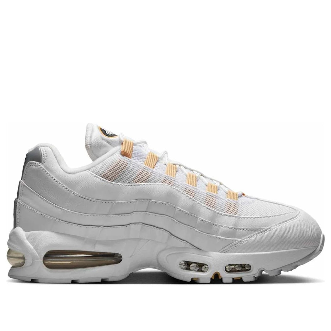 Men's white Nike Air Max 95 OG sneaker side view with gold lace trim and air units