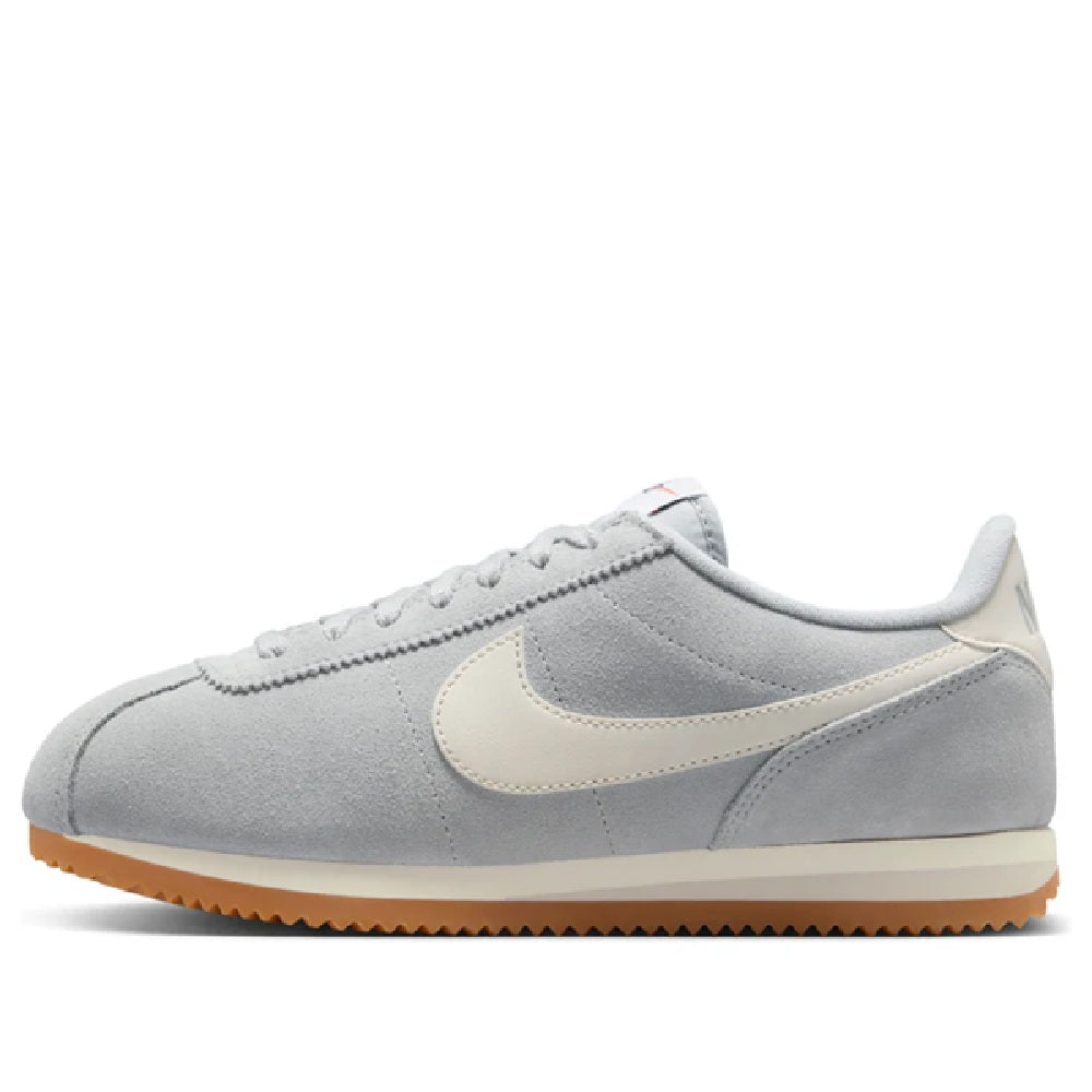 Women's Nike Cortez LT sneakers, smoke gray uppers, beige Swoosh, gum outsole.