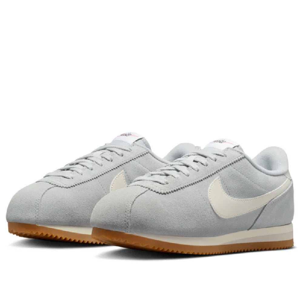 Women's Nike Cortez LT sneakers, smoke gray suede, beige Swoosh, gum rubber sole.