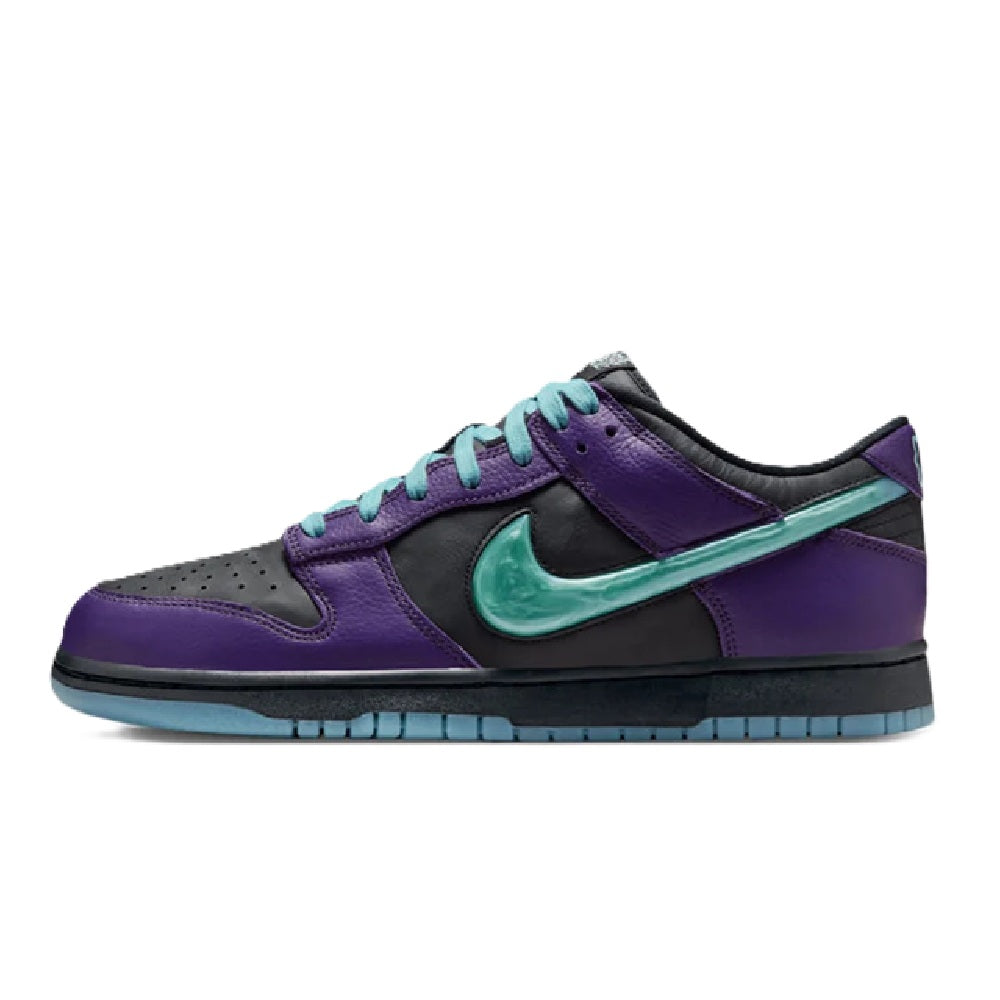 Nike low-top sneakers with purple panels, teal swoosh, black lining, and blue sole.