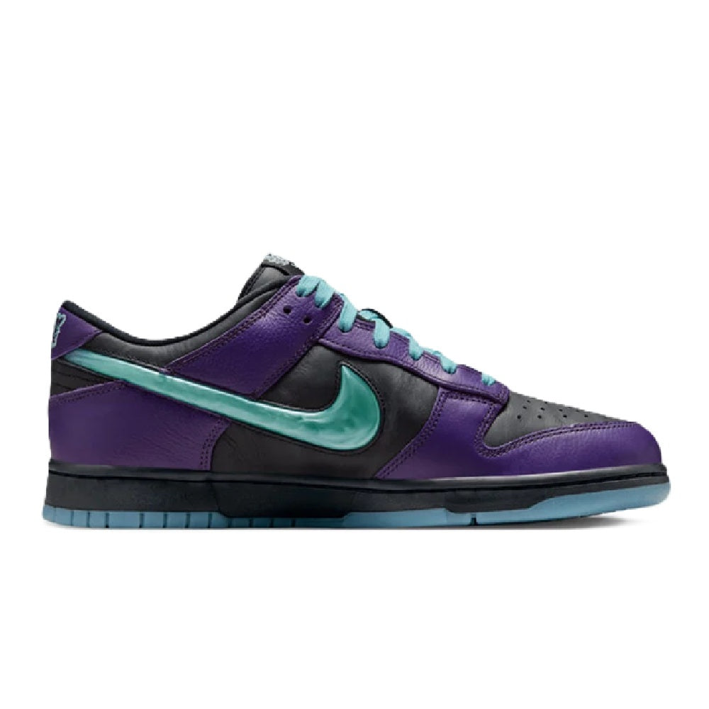 Nike low-top sneakers, side profile, purple upper with teal swoosh and blue outsole.