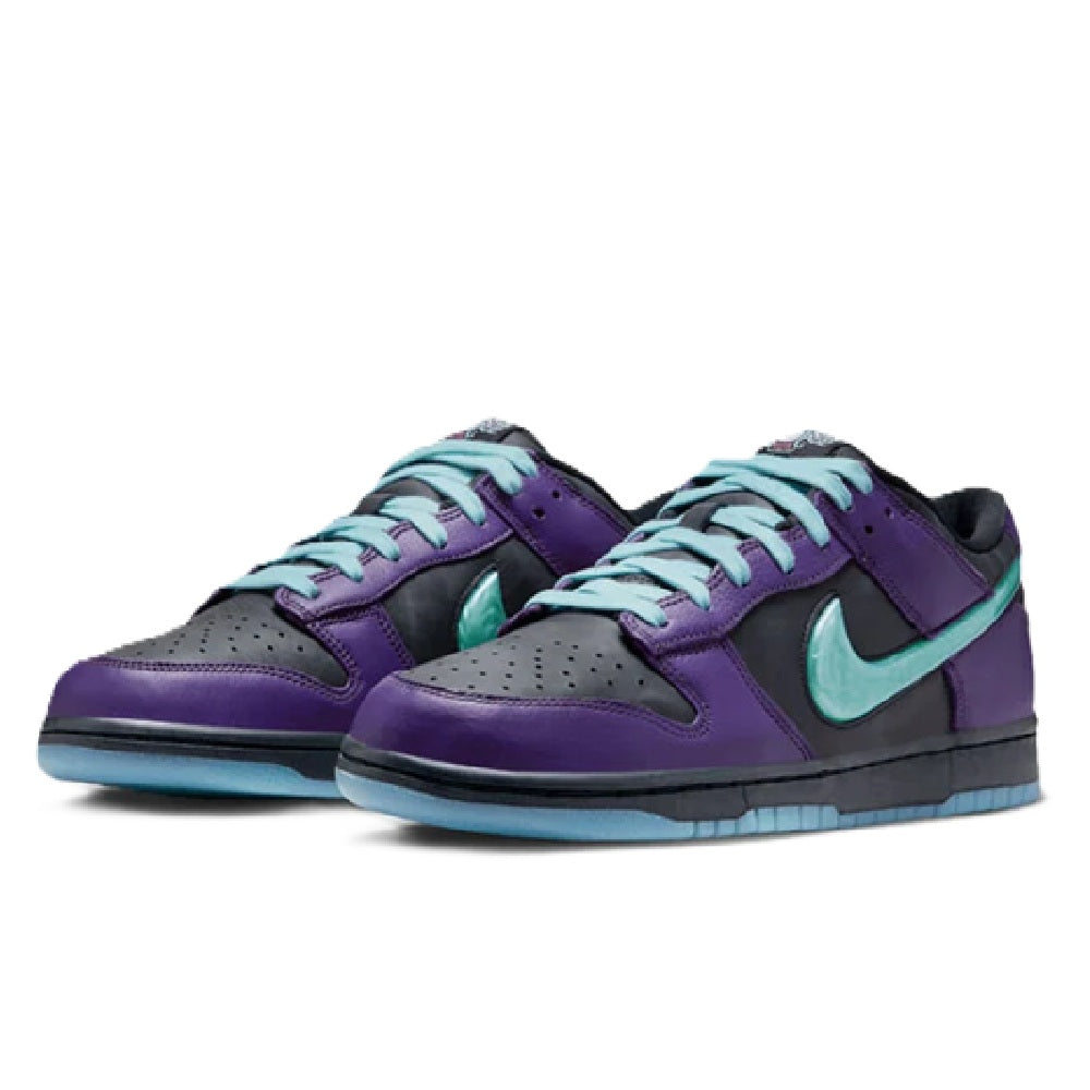 Pair of Nike low-top sneakers with purple laces, teal accents, and black toe overlays.