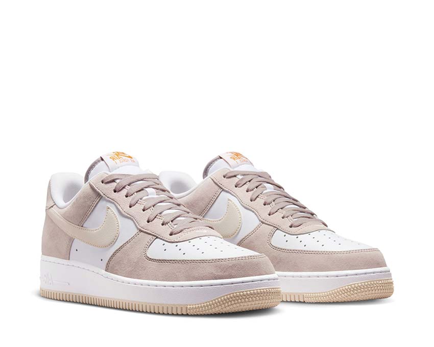 Beige suede low-top sneakers, white Swoosh and laces, with gum rubber sole