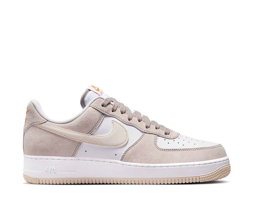 Beige and white low-top lace-up sneakers with suede panels and gum sole