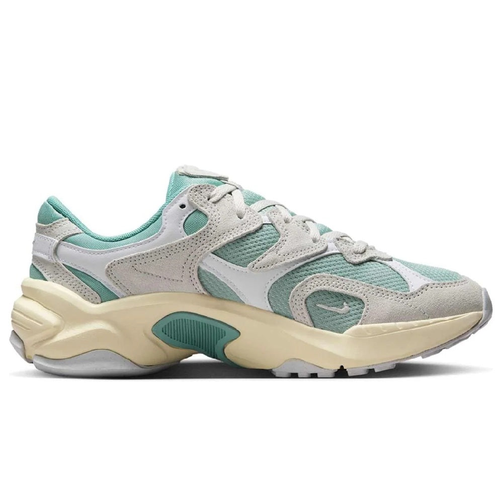 Women’s athletic sneaker side view with teal panels, white laces, and cream midsole