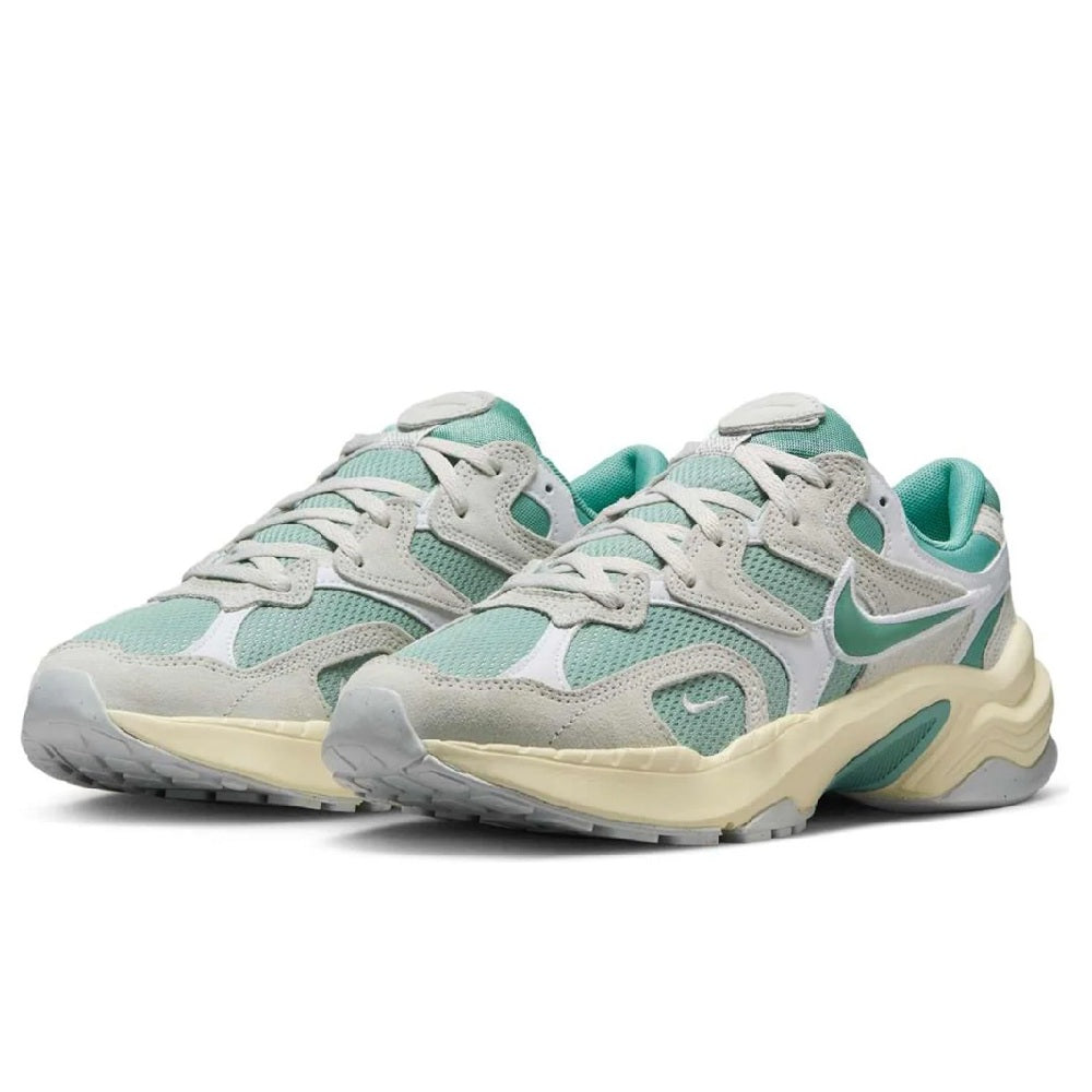 Women’s athletic sneaker pair with light gray uppers, teal details, and swoosh logo