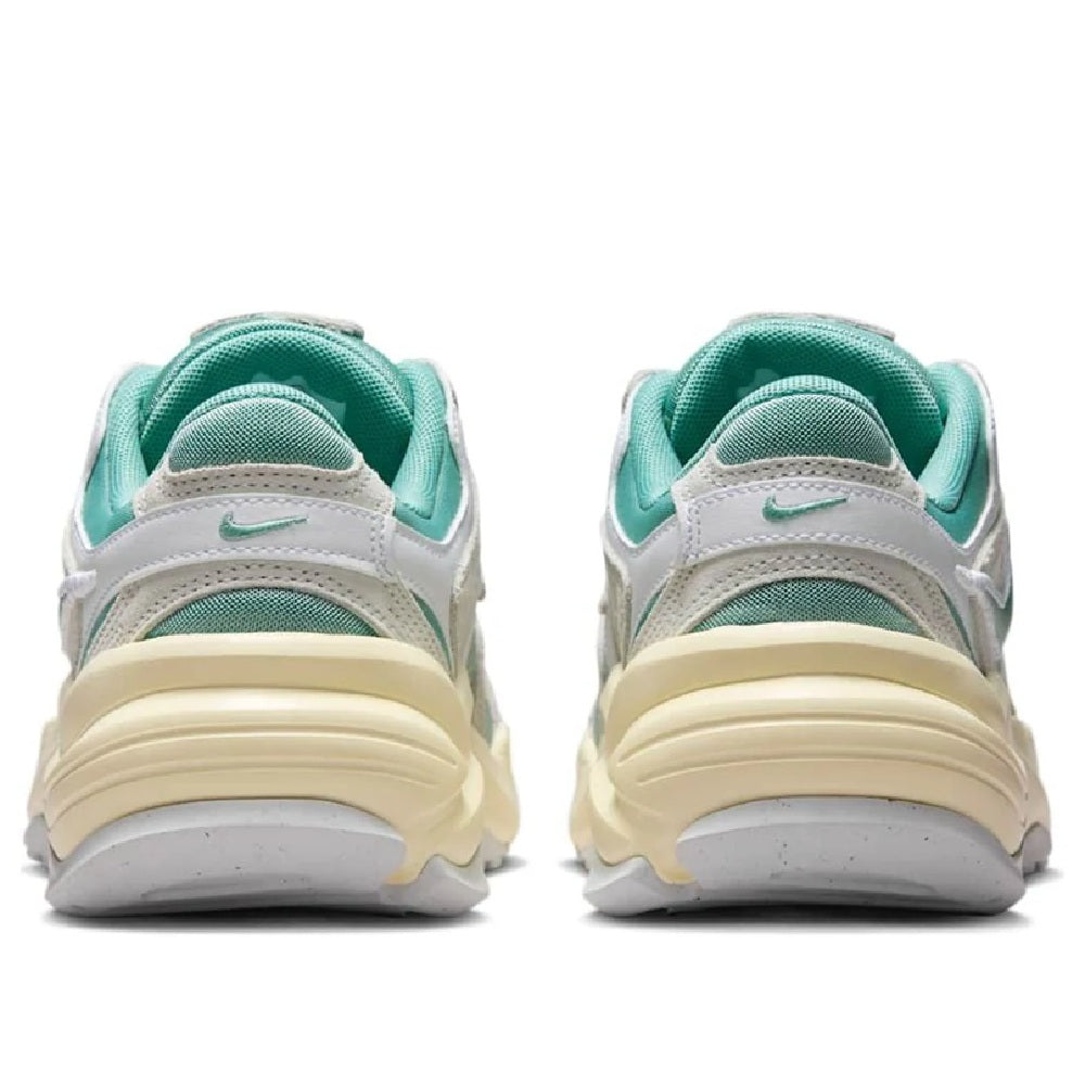 Women’s athletic sneaker back view with teal heel collar and padded light gray design