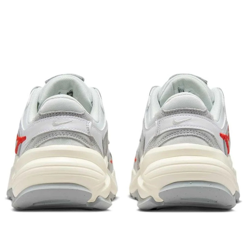Nike women's sneakers, white and light gray back view with red accents and cushioned heel