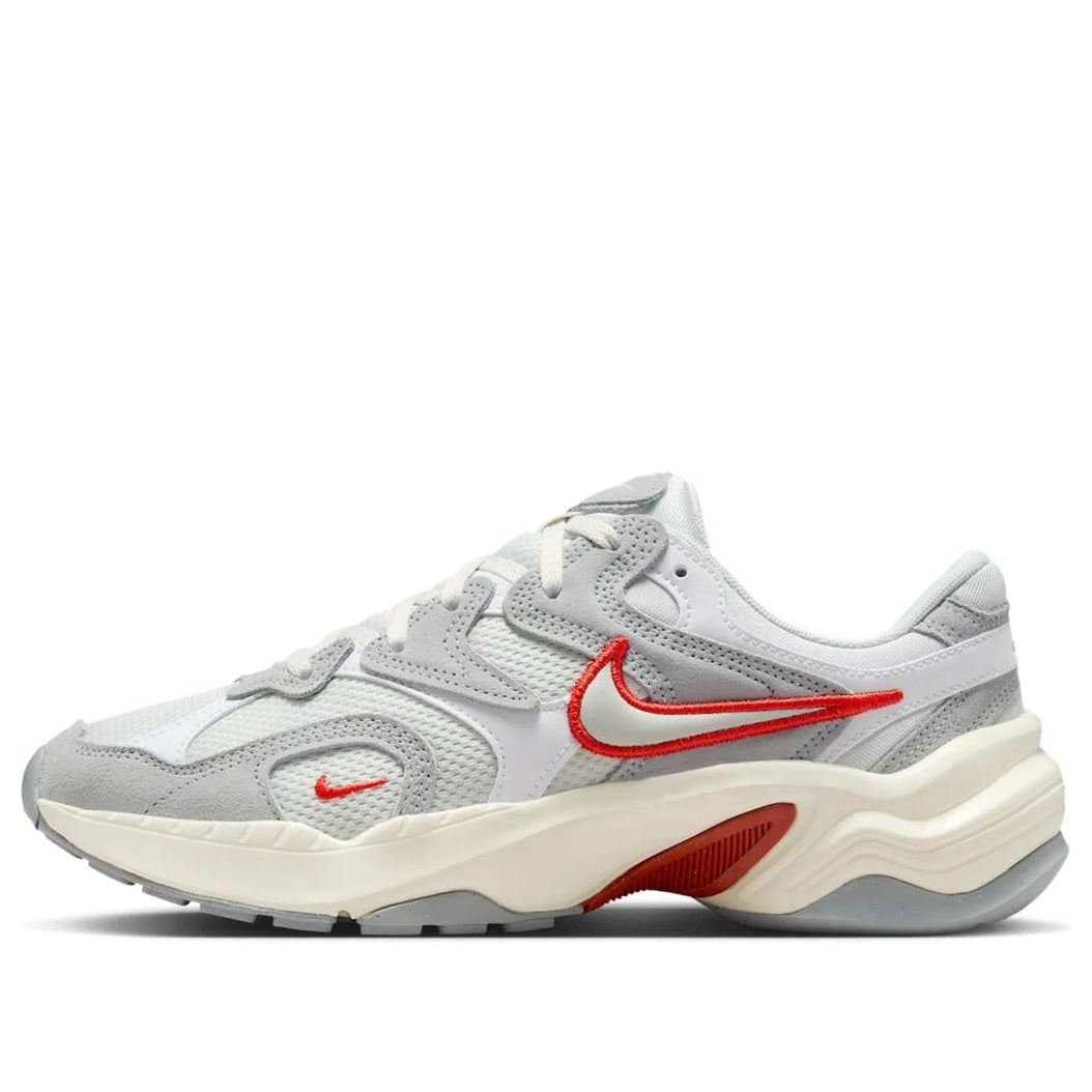 Nike women's low-top sneakers in light gray and white with red Swoosh accents