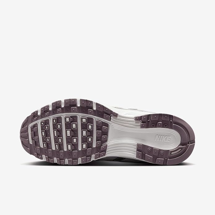 Nike P-6000 outsole view with textured traction rubber, dark taupe and white