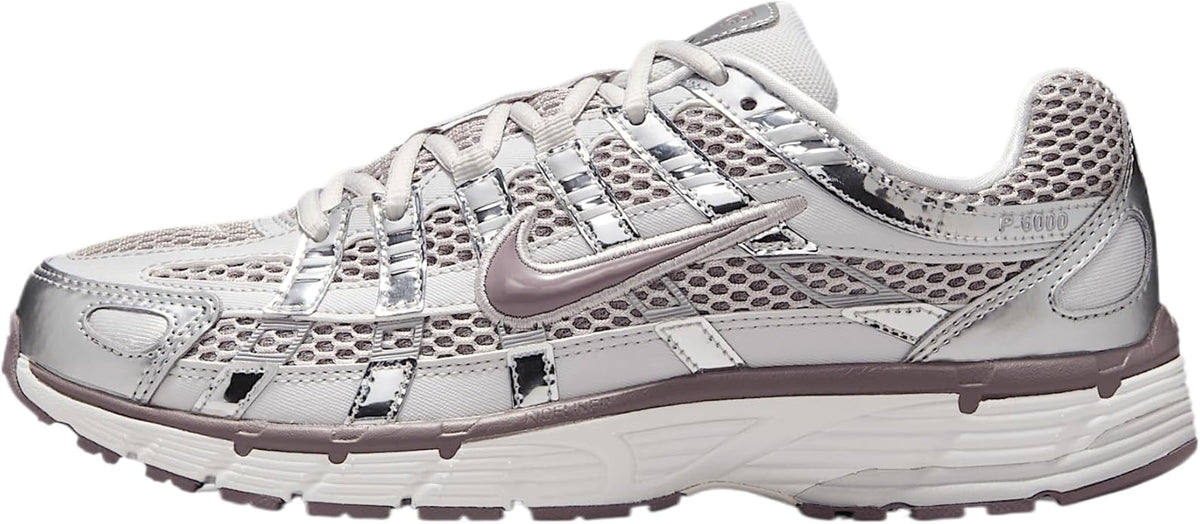 Women's Nike P-6000 sneakers in metallic silver with lavender accents, lace-up