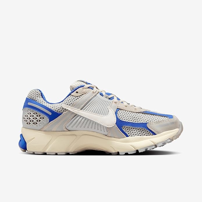 Nike Zoom Vomero 5 running sneaker side view, white mesh and royal blue overlays