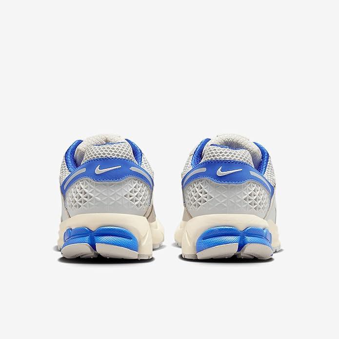 Nike Zoom Vomero 5 running sneaker heel view, white upper with blue heel pull tab