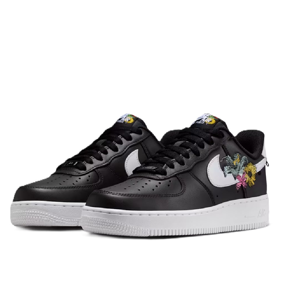 Pair of Women's Nike Air Force 1 PRM sneakers in black and white with colorful flower embroidery