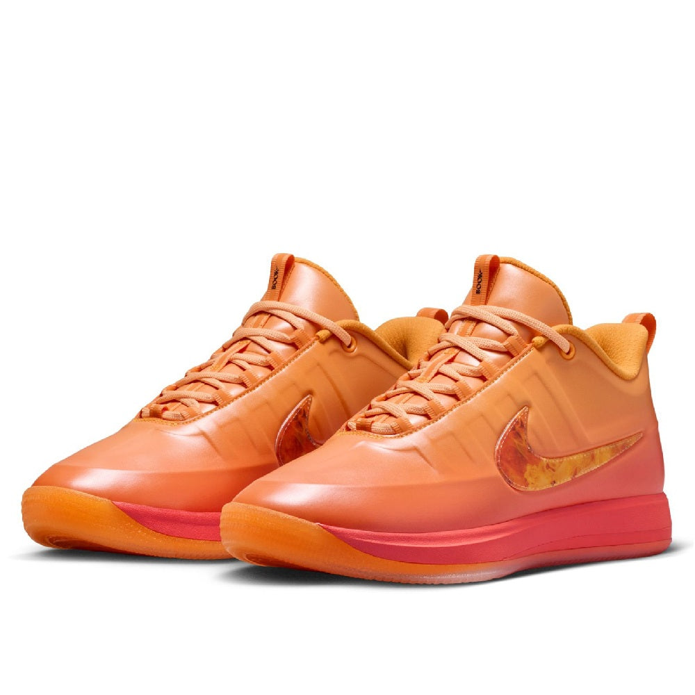 Pair of Nike low-top lace-up sneakers with orange gradient uppers and orange-pink soles
